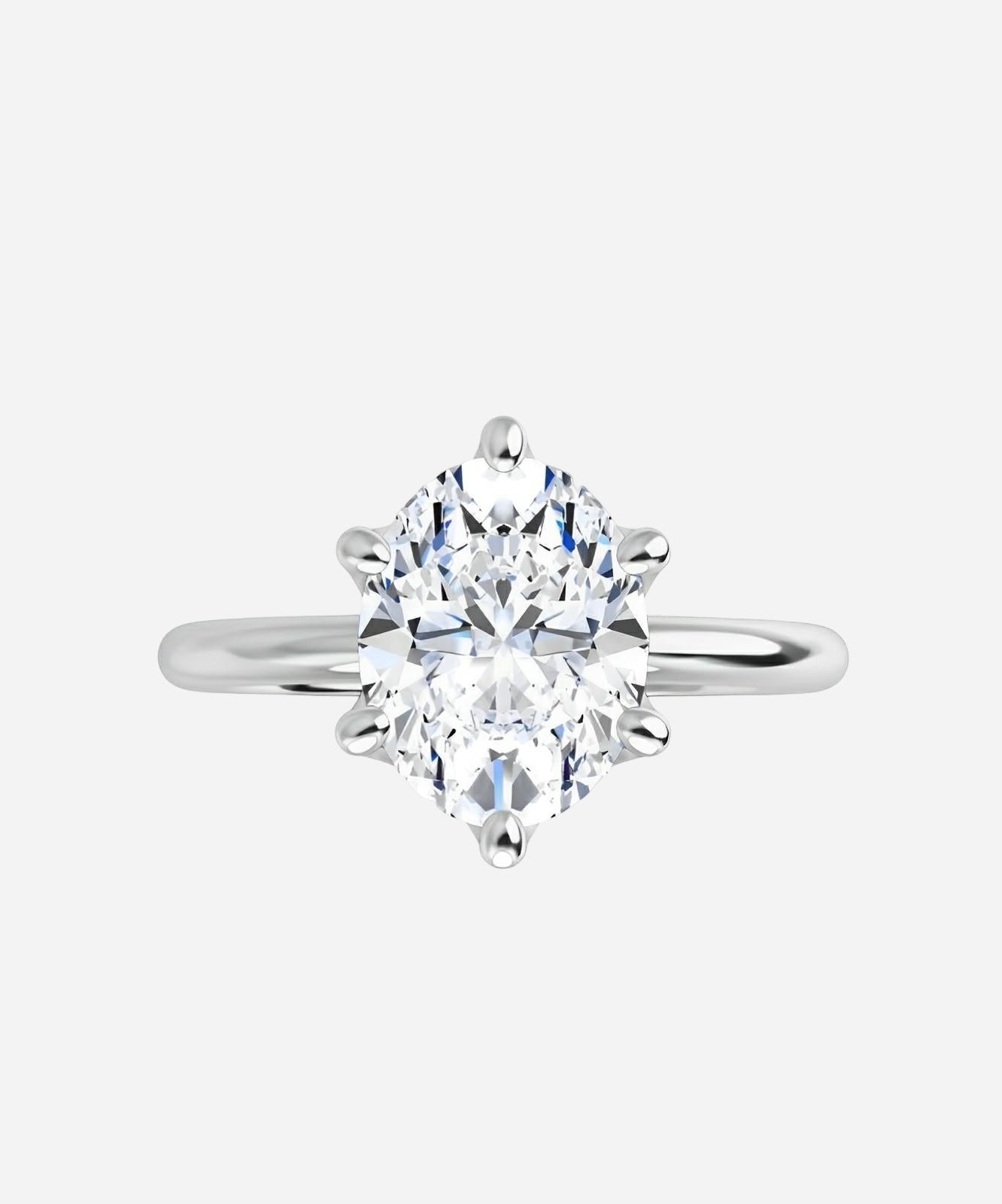 Yellow gold natural oval diamond ring.