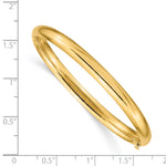 14k Yellow Gold Polished 5mm Hinged Bangle Bracelet, shown with a ruler for scale