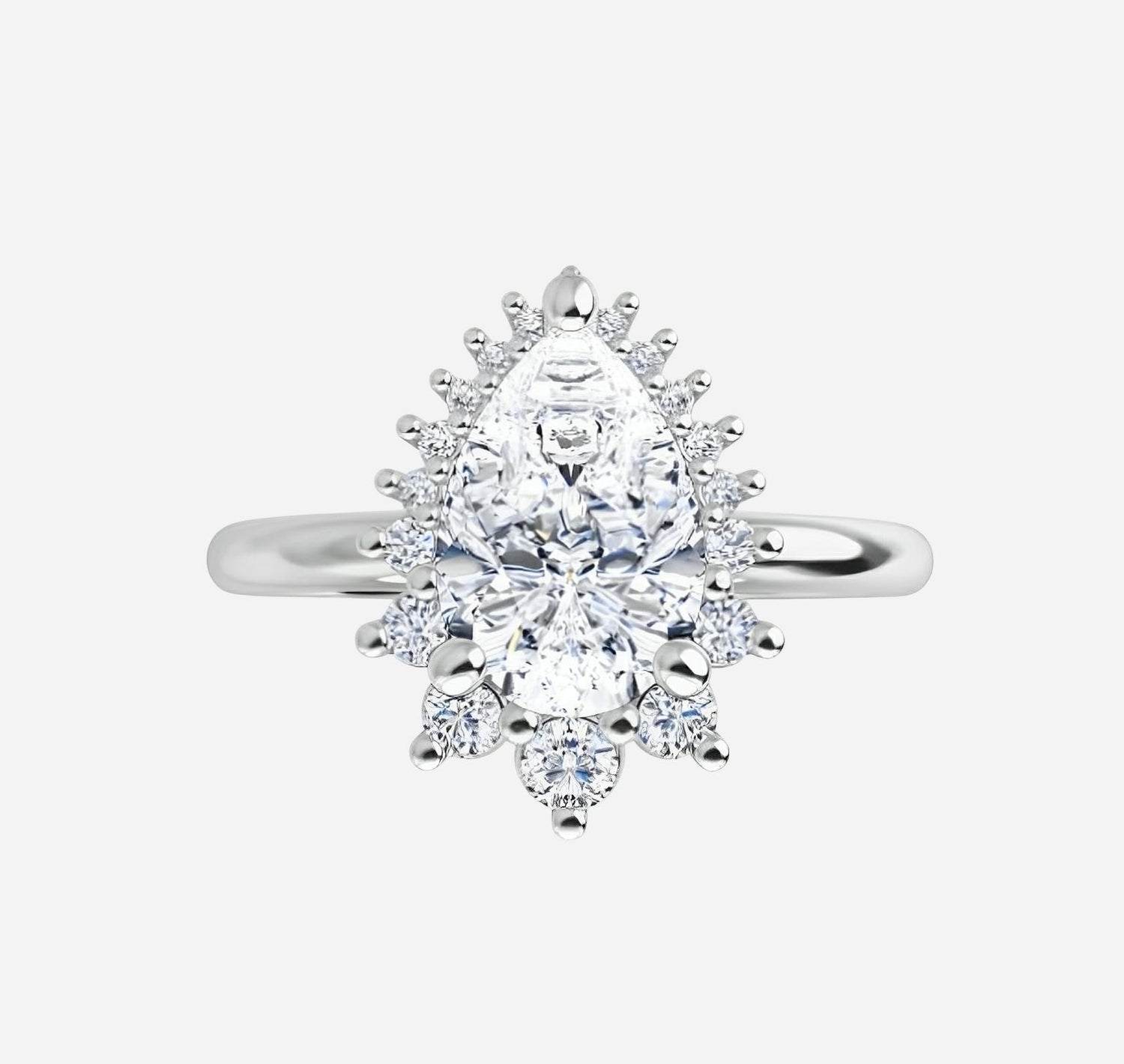 Bridal set, yellow gold and natural diamonds featuring pear-shaped diamond
