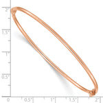 14k Rose Gold Polished 2.00mm Hinged Oval Bangle Bracelet, shown with a ruler for scale