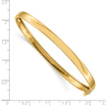 14k Yellow Gold Polished 5.00mm Flexible Oval Bangle Bracelet, shown with a ruler for scale