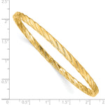 14k Yellow Gold Polished Textured Twist 4.00mm Slip-on Round Bangle Bracelet, shown with a ruler for scale