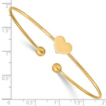 14k Yellow Gold Polished Heart 1.50mm Flexible Oval Bangle Bracelet, shown with a ruler for scale
