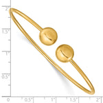 14k Yellow Gold Polished 9.5mm Ball 2.00mm Flexible Oval Cuff Bangle Bracelet, shown with a ruler for scale