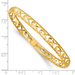 14k Yellow Gold Laser & Diamond-cut 6.15mm Pierced Flexible Oval Bangle Bracelet, shown with a ruler for scale