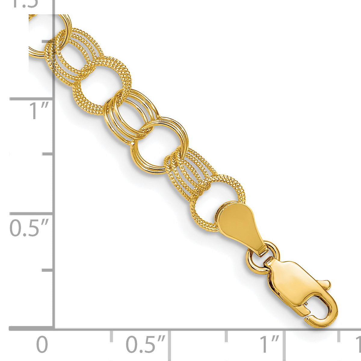 14k Yellow Gold 7.5mm Solid Polished and Textured Triple Link Charm Bracelet, shown with a ruler for scale - 7 in