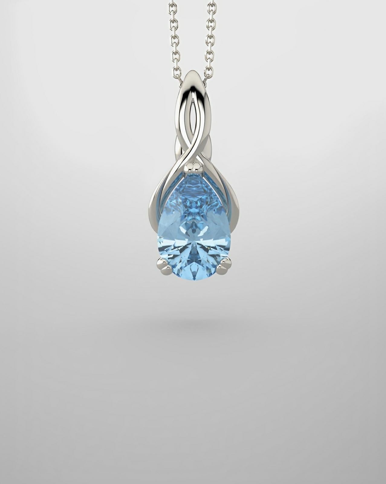 White gold pendant with imitation aquamarine