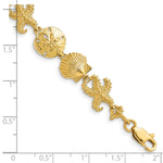14k Yellow Gold Polished Seashell Theme 7.25 inch Bracelet, shown with a ruler for scale