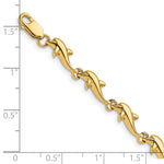 14k Yellow Gold Polished Dolphin 7 inch Bracelet, shown with a ruler for scale