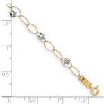 14k Two-Tone Gold Diamond-cut Puffed Stars Oval Link 7.25 inch Bracelet, shown with a ruler for scale