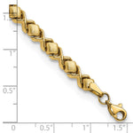 14k Yellow Gold Brushed and Polished Stampato 7.5 inch Bracelet, shown with a ruler for scale