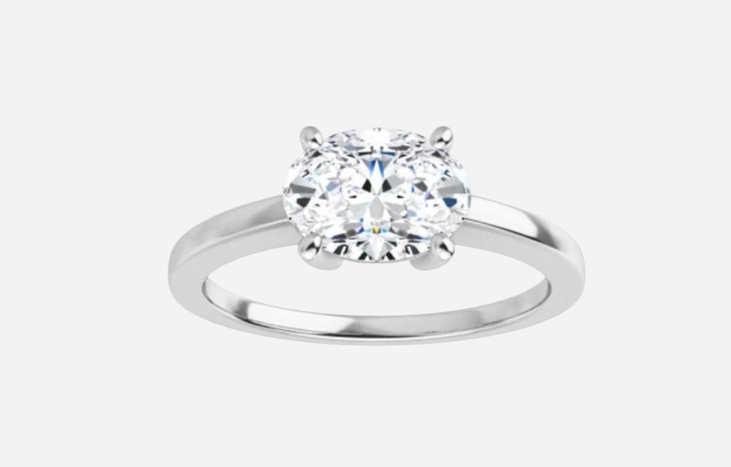 Moissanite oval 8x6mm in 10kt white gold.