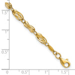 14k Yellow Gold Polished Fancy Twisted Oval Link 7.75 inch Bracelet, shown with a ruler for scale