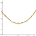 14k Yellow Gold Mirror Beads and Diamond-cut Rope Chain 7-Station 18 inch Necklace, shown with a ruler for scale