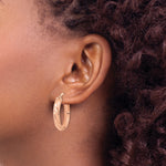 14k Rose Gold Polished Twisted Oval Hoop Earrings, view 3