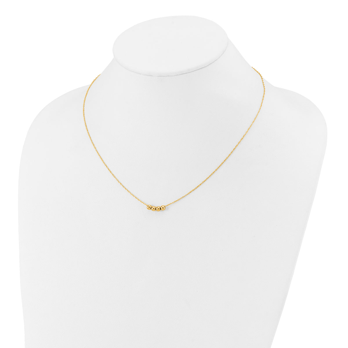 14k Yellow Gold Chain with Four 4mm Spacer Beads 18 inch Necklace, shown on a neck form