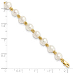 14k Yellow Gold 6-7mm White Round Freshwater Cultured Pearl 7.25 inch Bracelet, shown with a ruler for scale
