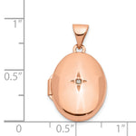 14k Rose Gold Diamond Star 17mm Oval Locket, shown with a ruler for scale